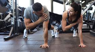 Toning Bingo Wings: Your Ultimate Guide to Sculpting Sleek Arms at the Gym 3 Fitness trainer demonstrating arm toning exercises Chigwell