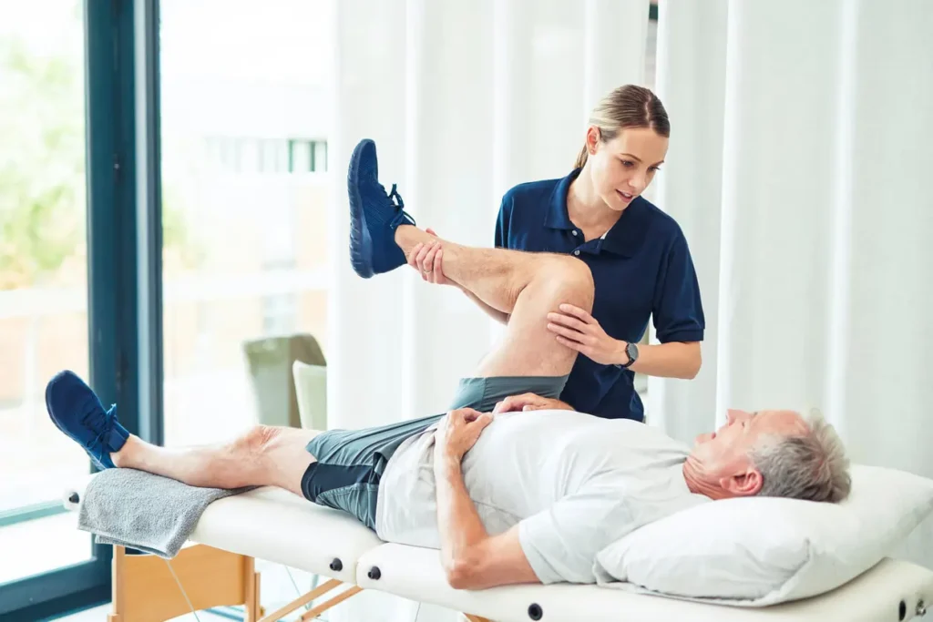 Revitalising Recovery: Effective Rehabilitation Strategies for Muscle Injuries 3 Physiotherapist assisting a patient with muscle recovery exercises Chigwell