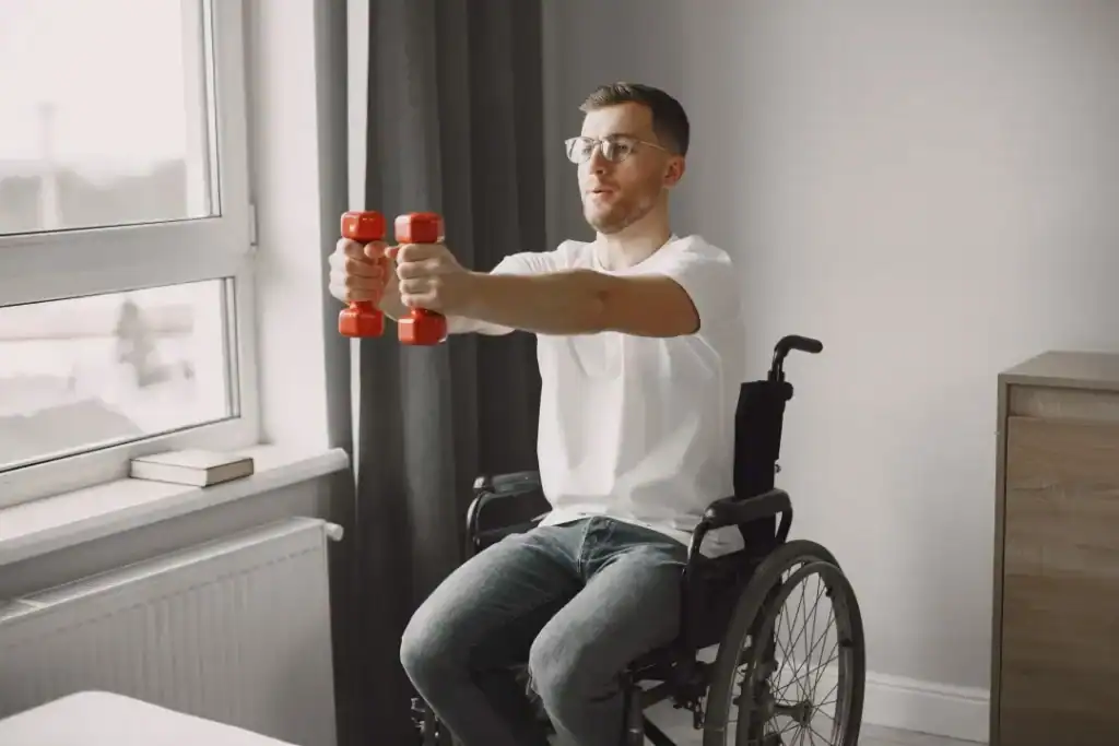Image of man doing exercise in his wheelchair to aid weight loss Chigwell