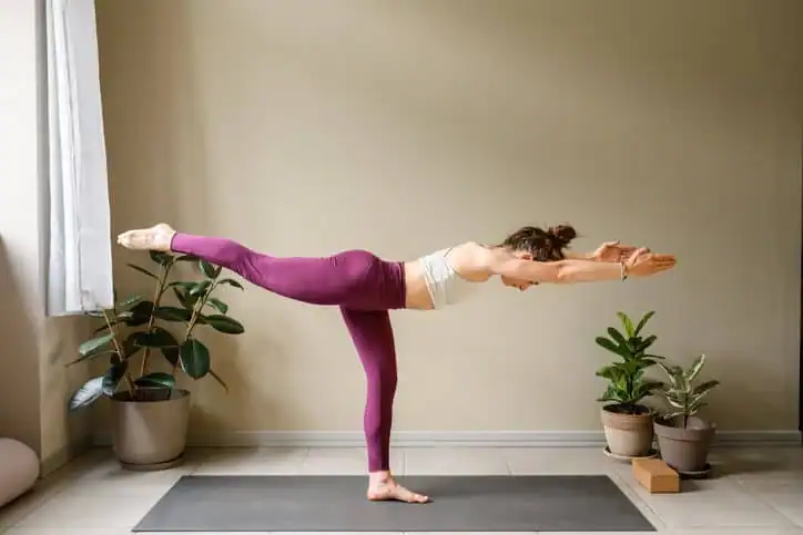 Woman doing Yoga exercise Chigwell to help with toning the body. 